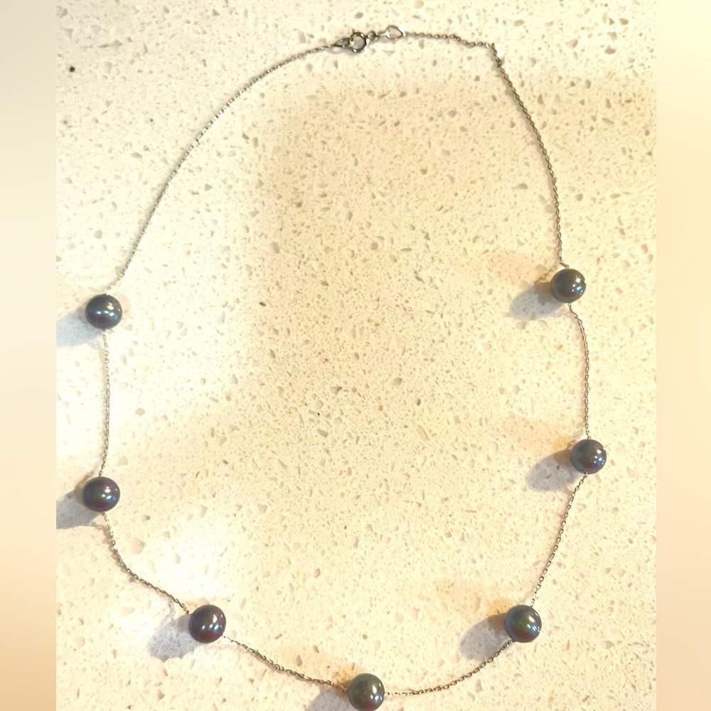 White gold necklace with black pearls. Delicate and light. Beautiful pie…